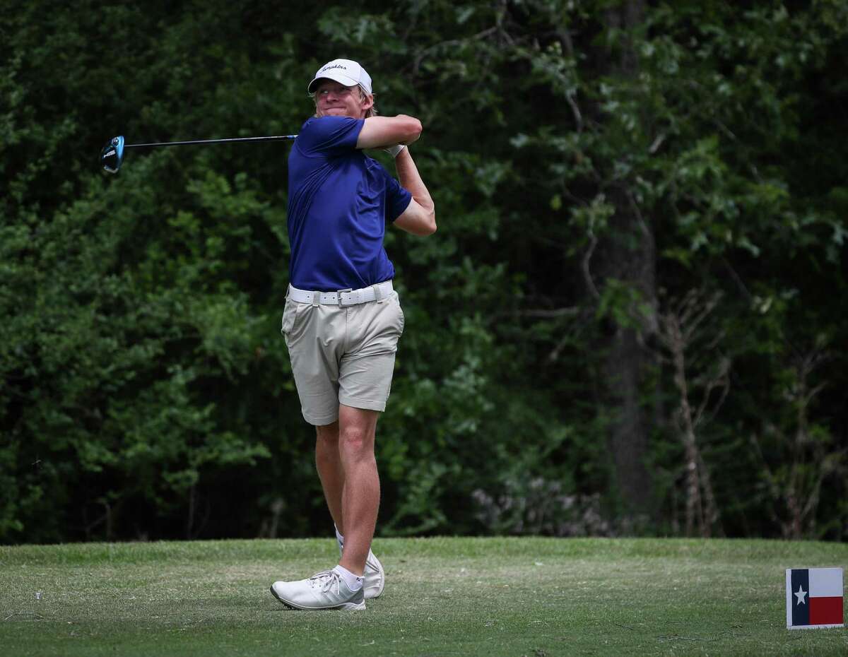 Colt Tenpenny watches his tee shot on the 17th hole during the second round of the Region III-6A Boys Championship golf tournament Thursday, April 21, 2022, at Eagle Pointe Golf Club in Mont Belvieu.
