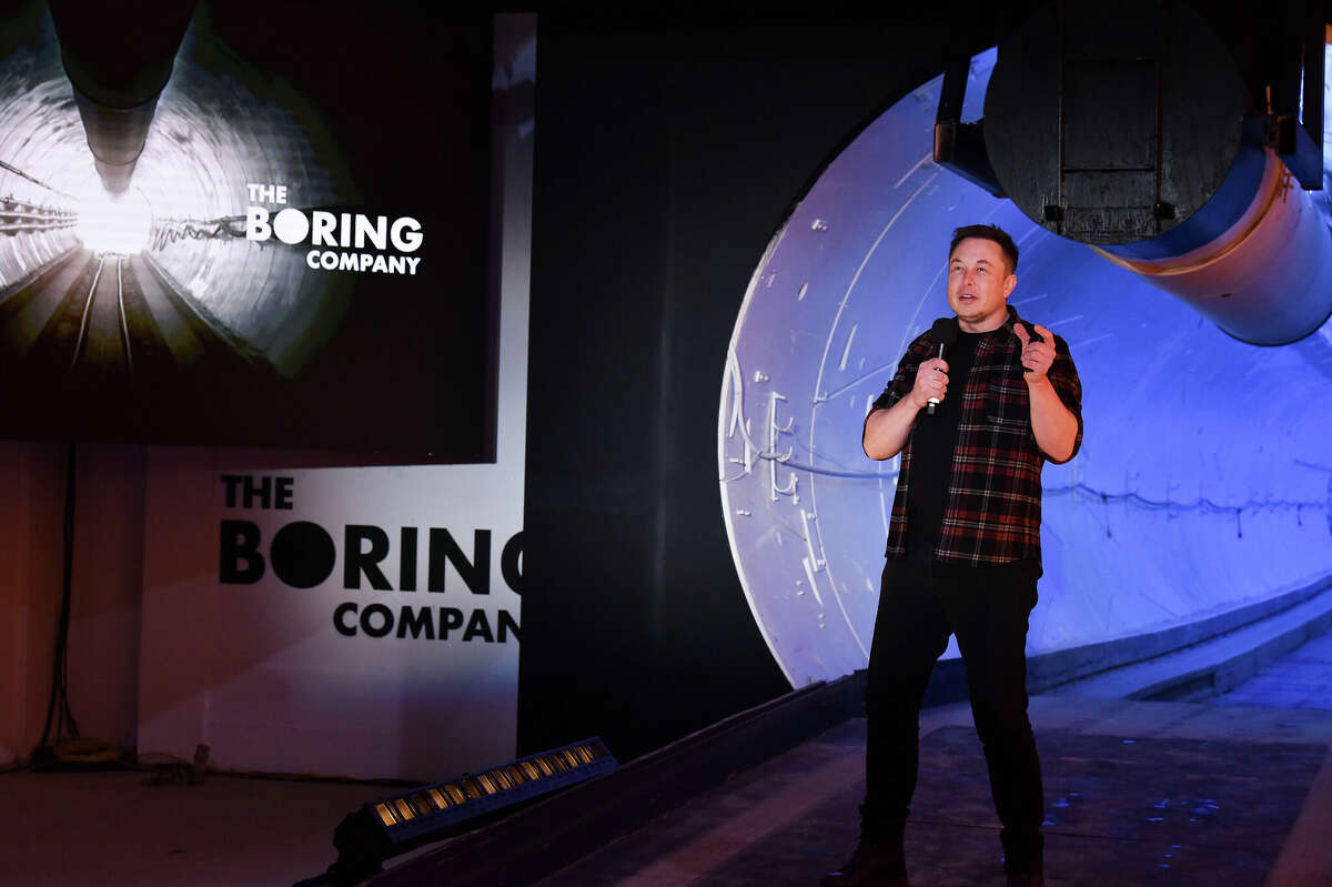 Elon Musk, co-founder and chief executive officer of Tesla Inc., speaks during an unveiling event for the Boring Company Hawthorne test tunnel in Hawthorne, south of Los Angeles, California on December 18, 2018. Musk has moved the company's headquarters to Pflugerville, Texas.