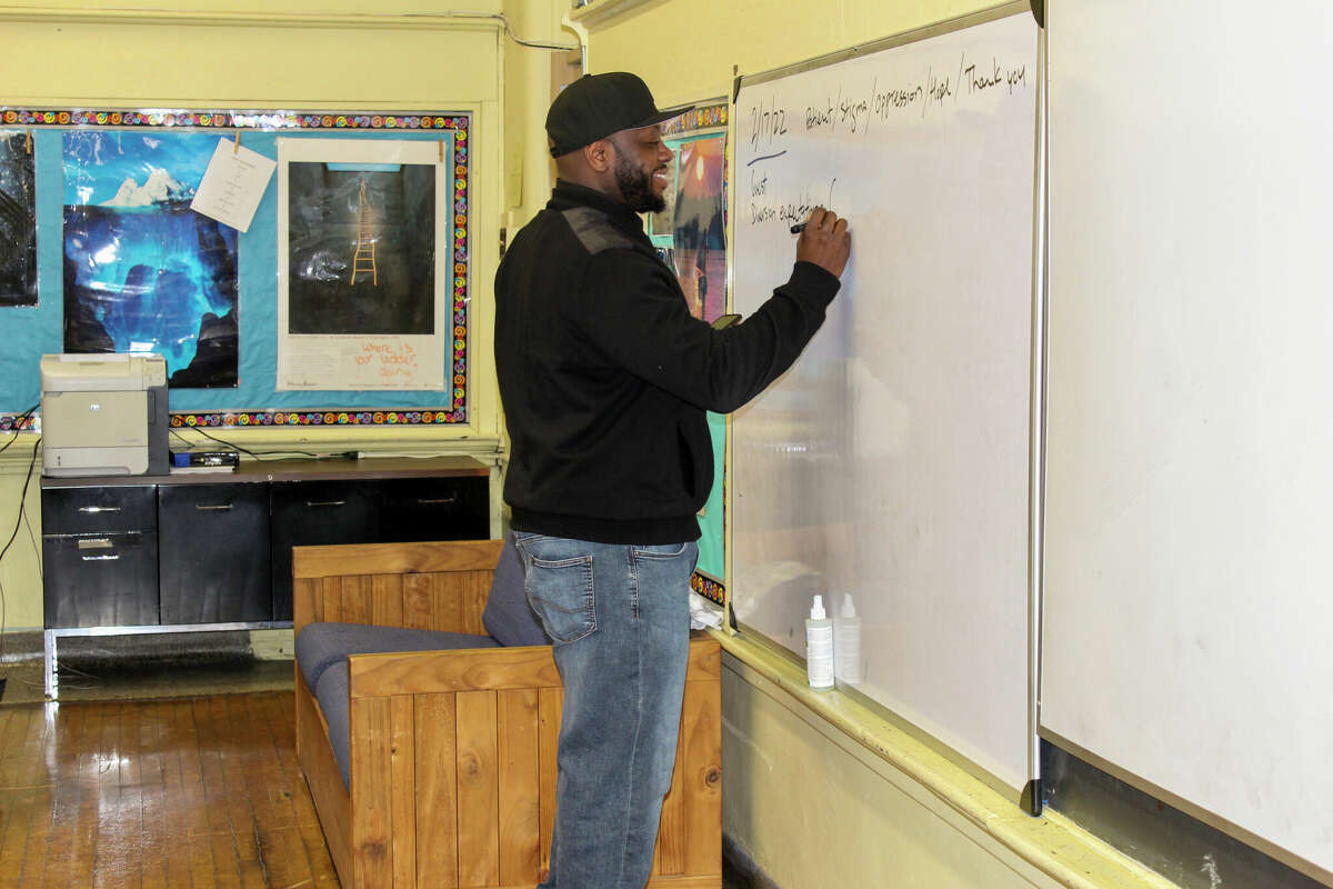 Diversion social worker Nathaniel Wylie prepares for the arrival of his first therapy group of the day. He and the Schenectady City School District’s only other diversion social worker hold eight group sessions weekly over the course of four days. 