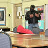 Nathaniel Wylie, who is trained in therapeutic crisis intervention, works with students participating in an aggression replacement group therapy session on how to recognize and control anger and other behaviors that landed them on long-term suspension.