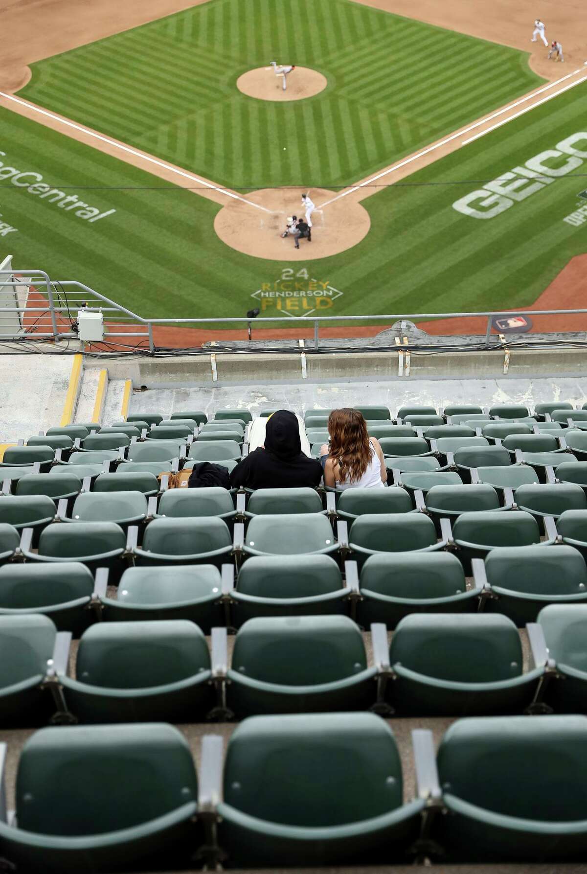 The Oakland Athletics Coliseum was nearly-empty in their first homestand as fan frustration mounts over ticket price hikes, roster turnover and threats to move. A couple watches the action from a mostly empty upper deck as Oakland Athletics play Baltimore Orioles in front of a couple thousand fans during MLB game at Oakland Coliseum in Oakland, Calif, on Wednesday, April 20, 2022.