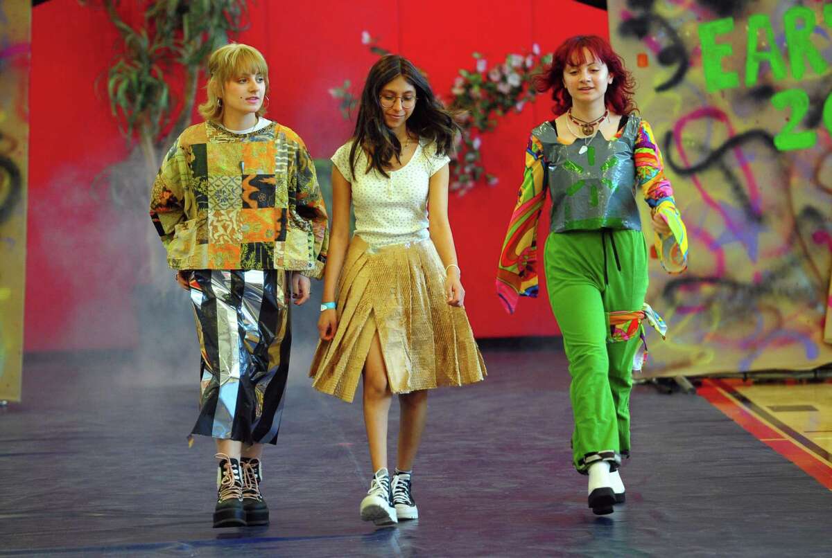 As part of J.M. Wright Technical High School's Earth Day Celebration, the school holds its "trashy" fashion show in the gymnasium in Stamford, Conn., on Friday April 22, 2022. Students have been tasked with creating wearable fashion using any type of recycled material, including plastic bags and bottles, packing materials, fabric scraps and swatches, coffee filters and cardboard.