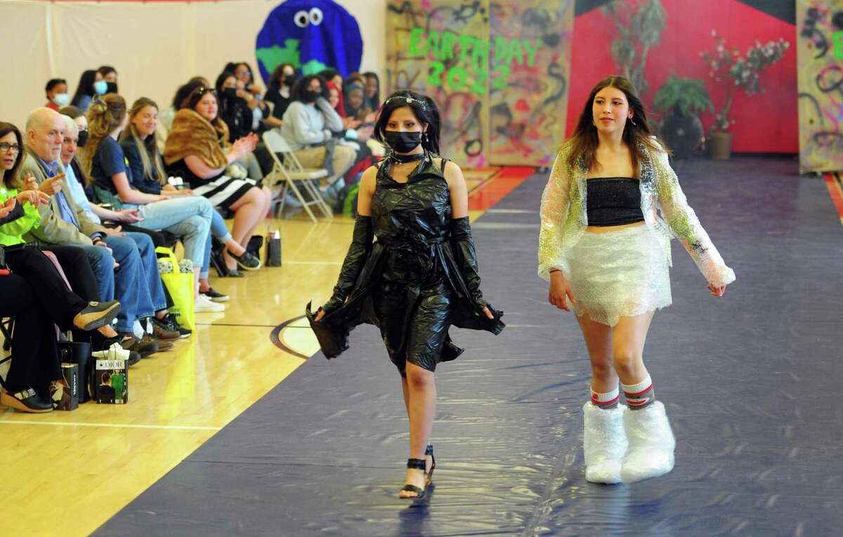 As part of J.M. Wright Technical High School's Earth Day Celebration, the school holds its "trashy" fashion show in the gymnasium in Stamford, Conn., on Friday April 22, 2022. Students have been tasked with creating wearable fashion using any type of recycled material, including plastic bags and bottles, packing materials, fabric scraps and swatches, coffee filters and cardboard.