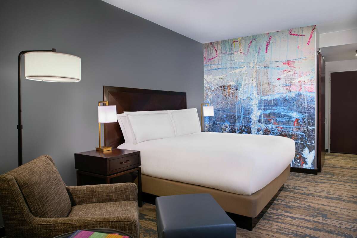 Local artists were commissioned to paint murals inside the upgraded guest rooms in the Hilton Americas-Houston.