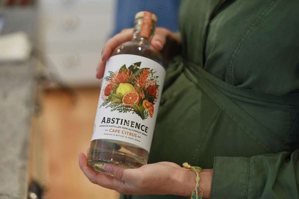 Adrienne Stillman Krausz of Dry Goods Beverage Co. holds a bottle of Cape Citrus Abstinence nonalcoholic spirit at her home in Napa.