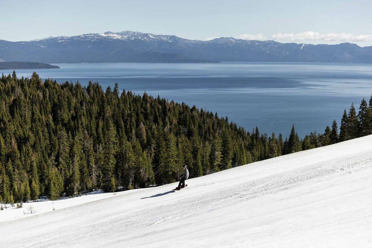 A snowboarder enjoys the spring conditions at Homewood Mountain Resort near Lake Tahoe.