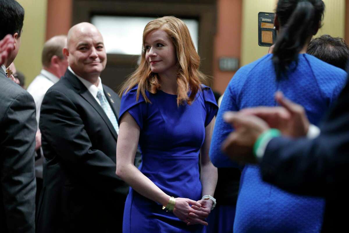Michigan state Sen. Mallory McMorrow, center, is shown at the state Capitol before the State of the State address, Wednesday, Jan. 29, 2020, in Lansing, Mich.