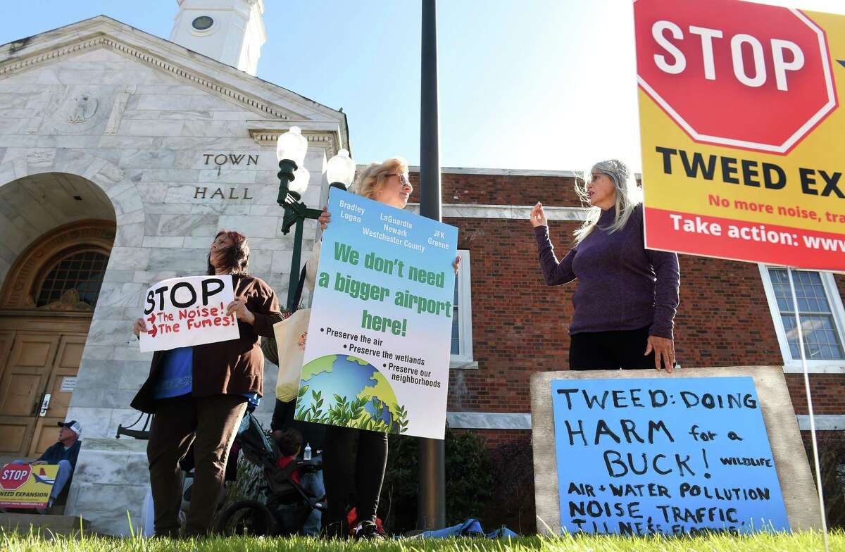 From left, Gloria DePalma of East Haven, Carolyn Rostkowski of New Haven and Joan Sayers of East Haven protest the expansion of Tweed New Haven Regional Airport in front of East Haven Town Hall on April 22, 2022.