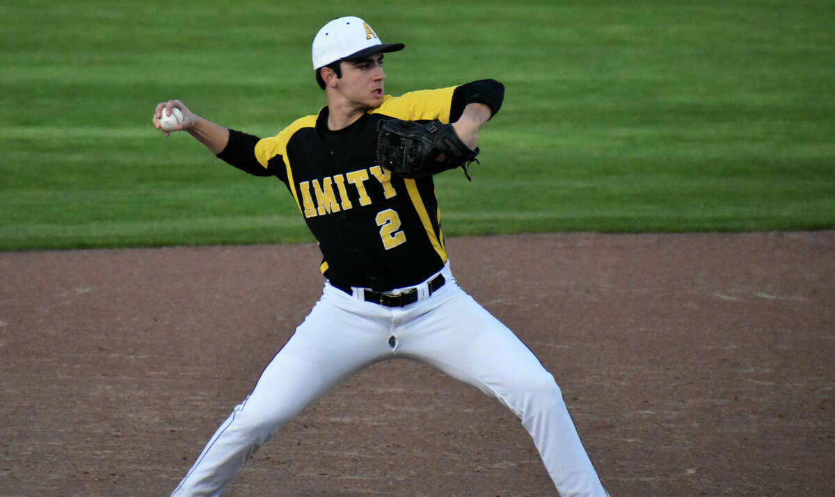 Amity's Paul Canalori throws the ball to first during a baseball game between Amity and Xavier at Palmer Field, Middletown on Friday, April 22, 2022.