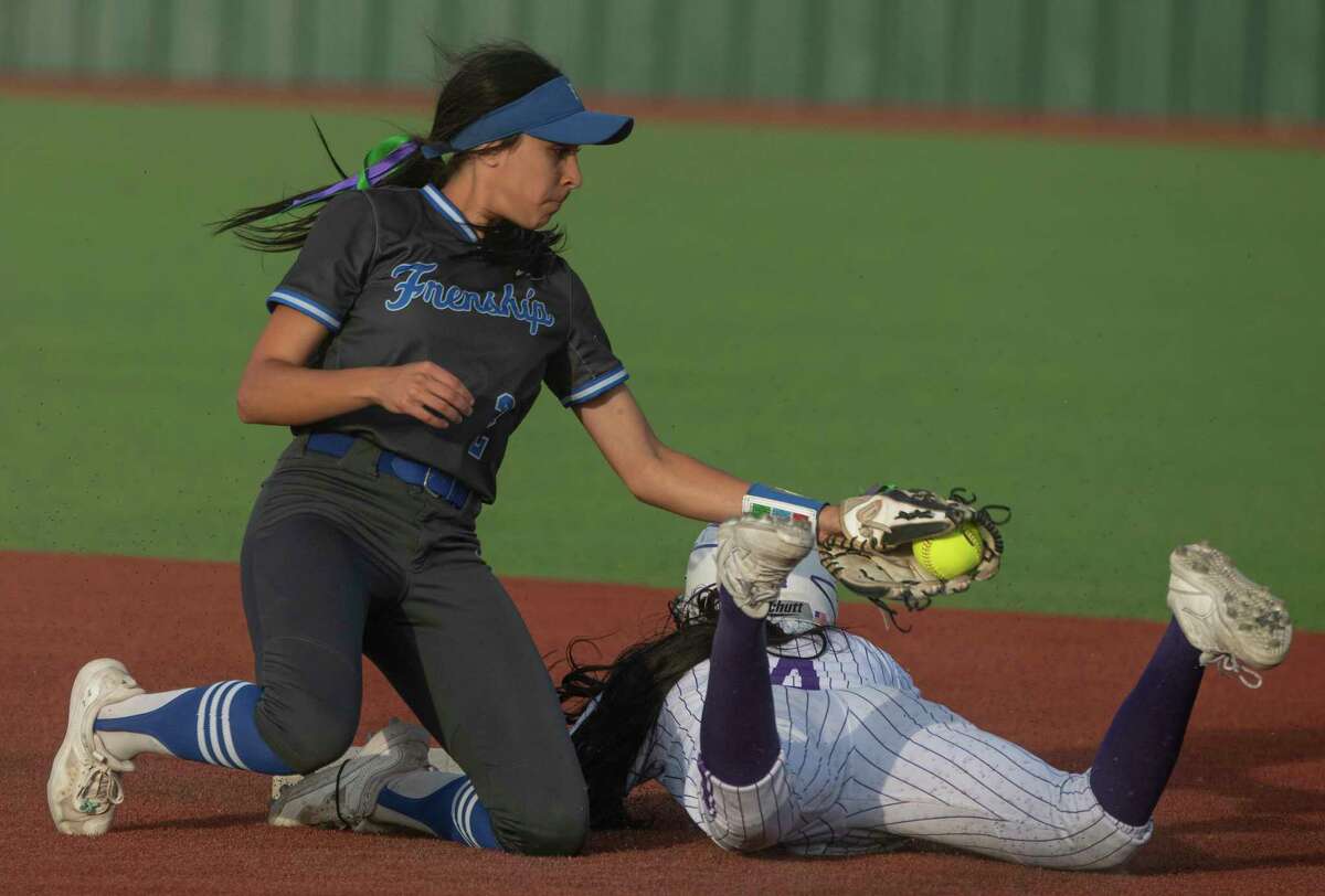 Midland High's Nalaney Paul safely steals second as she slides under the tag of Frenship's Makayla Garcia 04/22/2020 at Martin Field. Tim Fischer/Reporter-Telegram