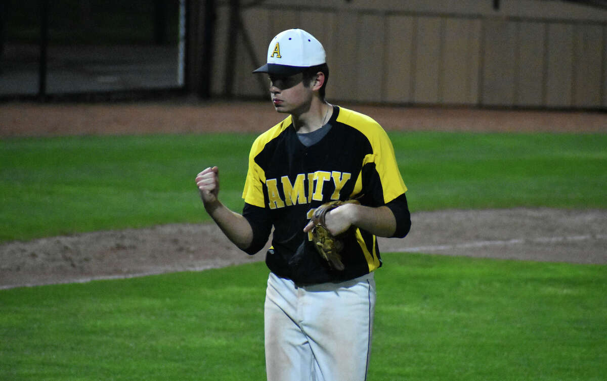 Amity's Mac Burke pumps his fist after the final out of the baseball game between Amity and Xavier at Palmer Field, Middletown on Friday, April 22, 2022.