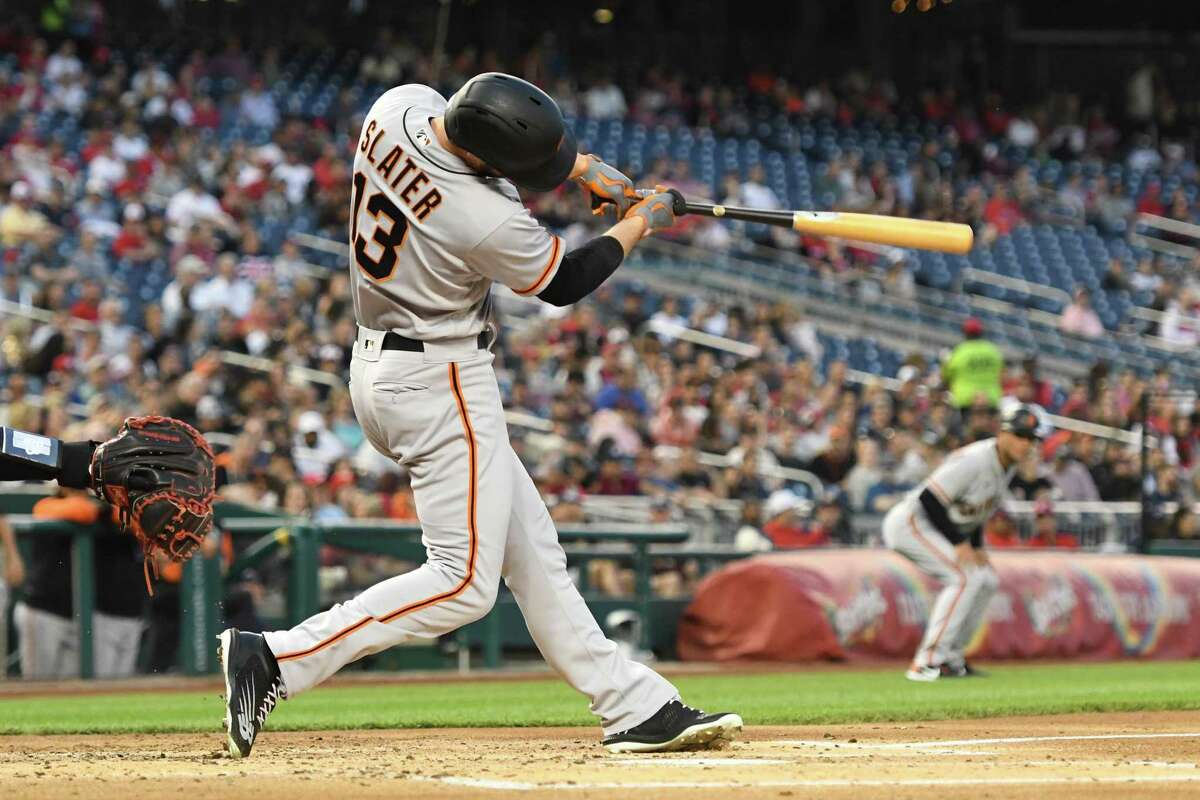 WASHINGTON, DC - APRIL 22: Austin Slater #13 of the San Francisco Giants hits a three home run in the second inning during a baseball game against the Washington Nationals at the Nationals Park on April 22, 2022 in Washington, DC. (Photo by Mitchell Layton/Getty Images)