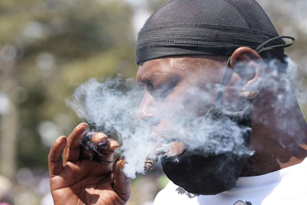 Delvis Qiyama of San Francisco partakes in the 4/20 festival on Wednesday.