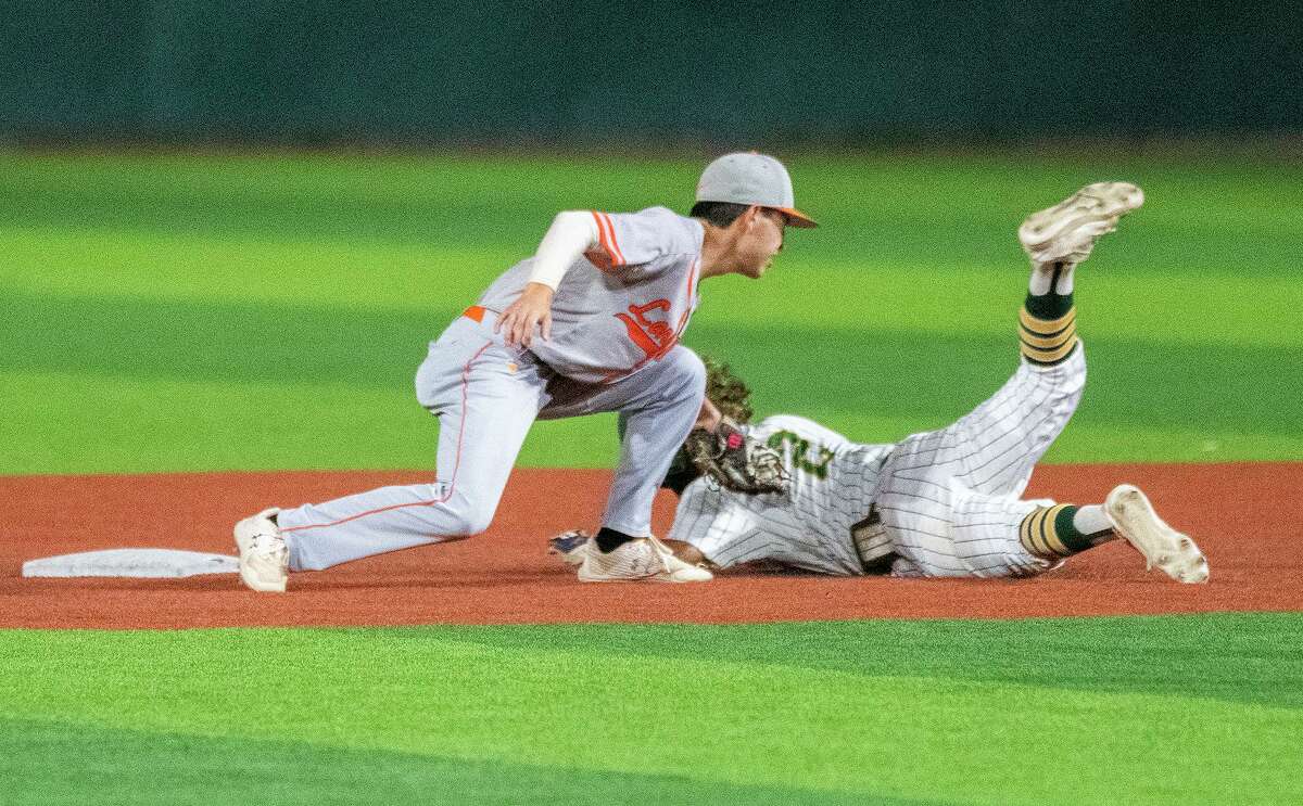 Nixon High School’s Brayan Rodriguez slides into second base as United High School gets the out, Friday, April 22, 2022 at Veteran's Field.