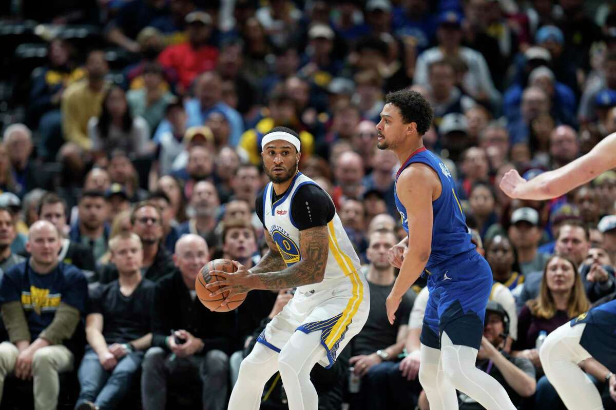 Golden State Warriors guard Gary Payton II (0) and Denver Nuggets guard Bryn Forbes (6) in the second half of Game 3 of an NBA basketball first-round Western Conference playoff series Thursday, April 21, 2022, in Denver. (AP Photo/David Zalubowski)