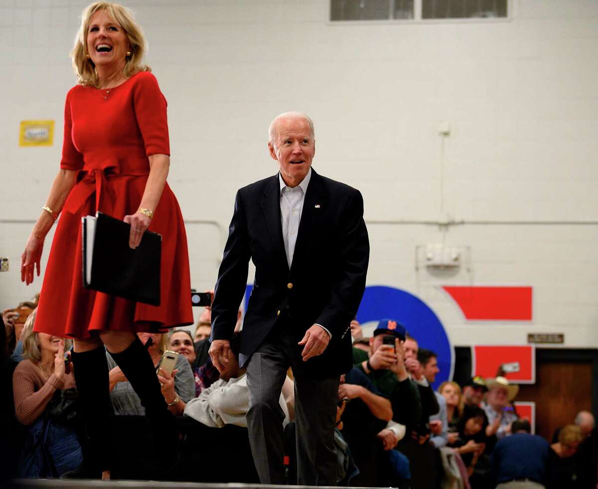 Democratic presidential candidate former Vice President Joe Biden and his wife, Jill, arrive to speak at a town hall event in Des Moines, Iowa, on Feb. 2, 2020. The Democratic National Committee has decided to allow new states to bid for the coveted status, which has long belonged to places like Iowa and New Hampshire, in an effort to kick off the nominating process in states that better reflect the diversity of the broader electorate.