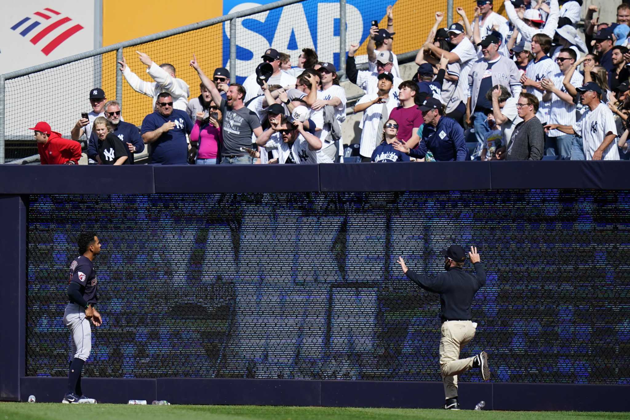 Moment Cleveland Guardians outfielder Myles Straw climbs up bleachers and  screams at Yankees fan