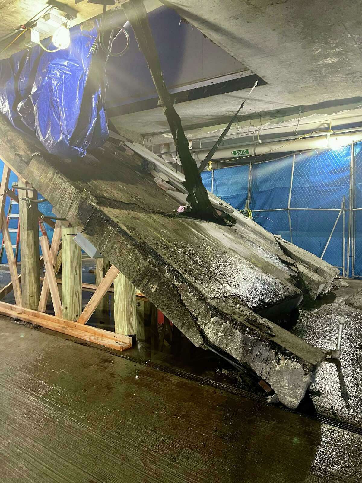 Part of an outdoor terrace collapsed into an indoor parking garage at Allure, a Stamford high-rise apartment complex, on Feb. 1, 2022.
