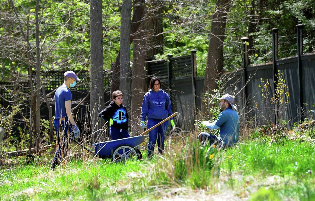 The Greenwich Land Trust hosts "Earth Day, A Day of Action," at the Mueller Preserve in Greenwich, Conn., on Saturday April 23, 2022. Volunteers from several groups like Brunswick Conservation Corp and Greenwich Grown, came out to work in the garden, plant native shrubs and wildflowers as well as remove invasive plants.