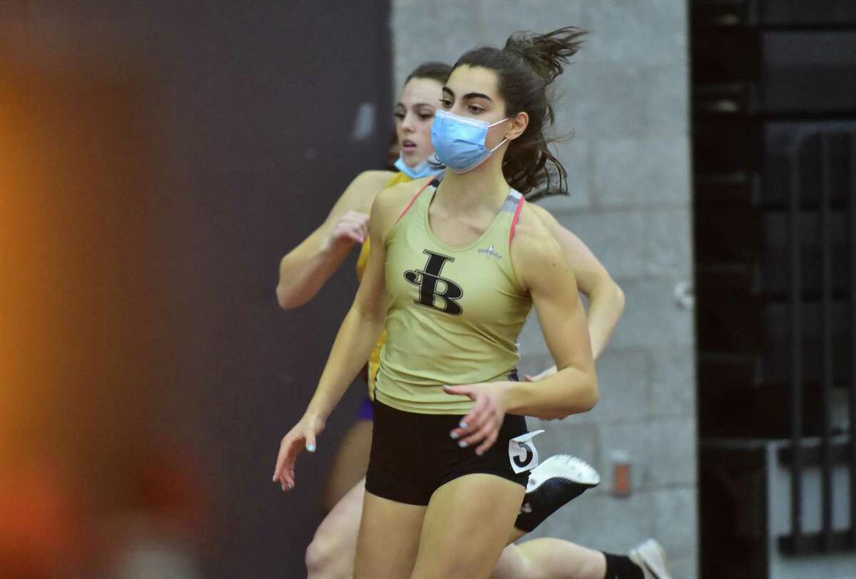 Joel Barlow's Mariella Schweitzer competes in the 300-meter dash during the CIAC indoor track championships Feb. 10.