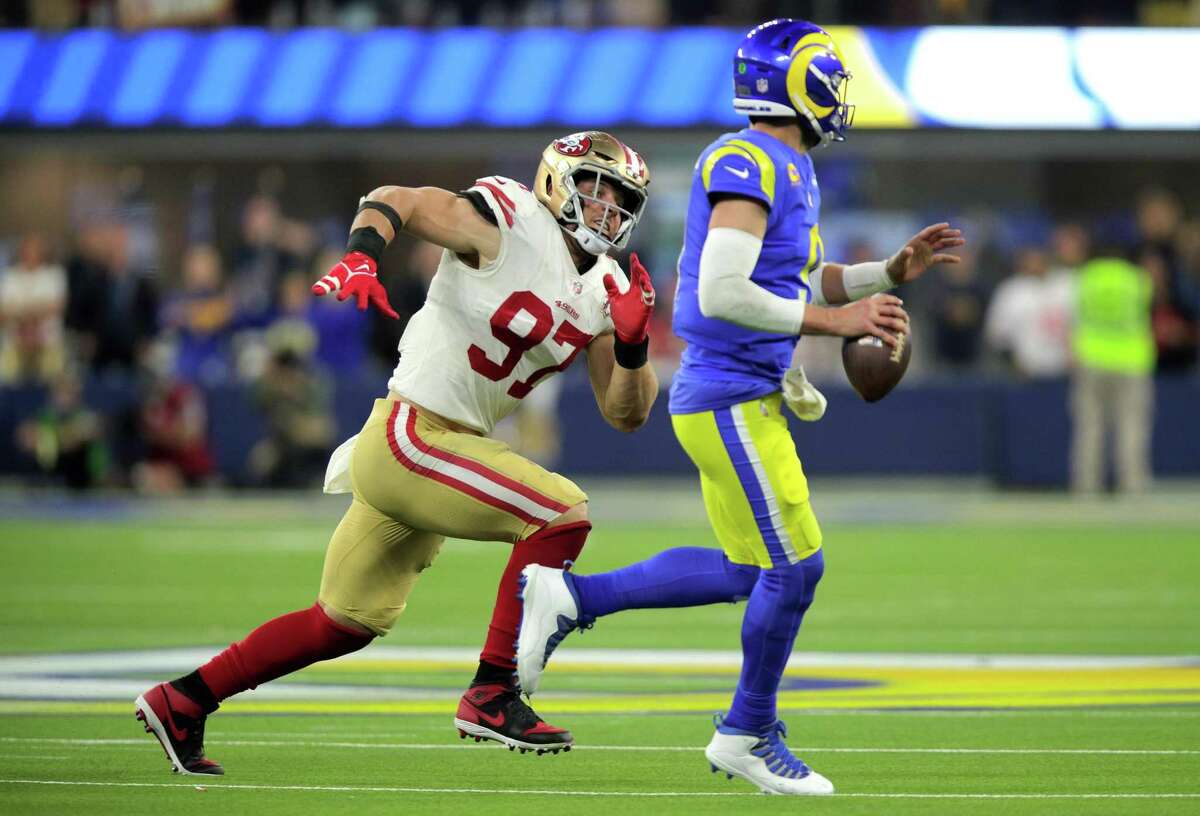 Nick Bosa (97) chases down Matthew Stafford (9) in the fourth quarter as the San Francisco 49ers played the Los Angeles Rams in the NFL Championship game at SoFi Stadium in Inglewood, Calif., on Sunday, January 30, 2022.