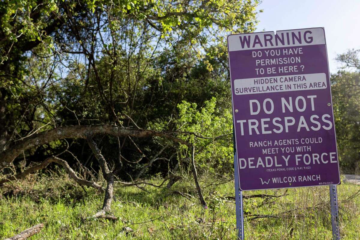 Signs posted to keep out trespassers is seen outside Ridley Cemetery in Seguin on April 7.