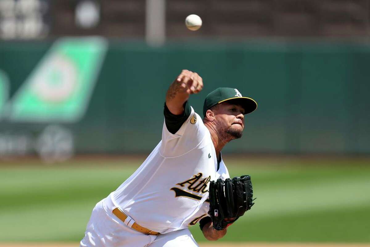 Oakland Athletics starting pitcher Frankie Montas throws against the Texas Rangers during the fourth inning of a baseball game in Oakland, Calif., Saturday, April 23, 2022. (AP Photo/Jed Jacobsohn)
