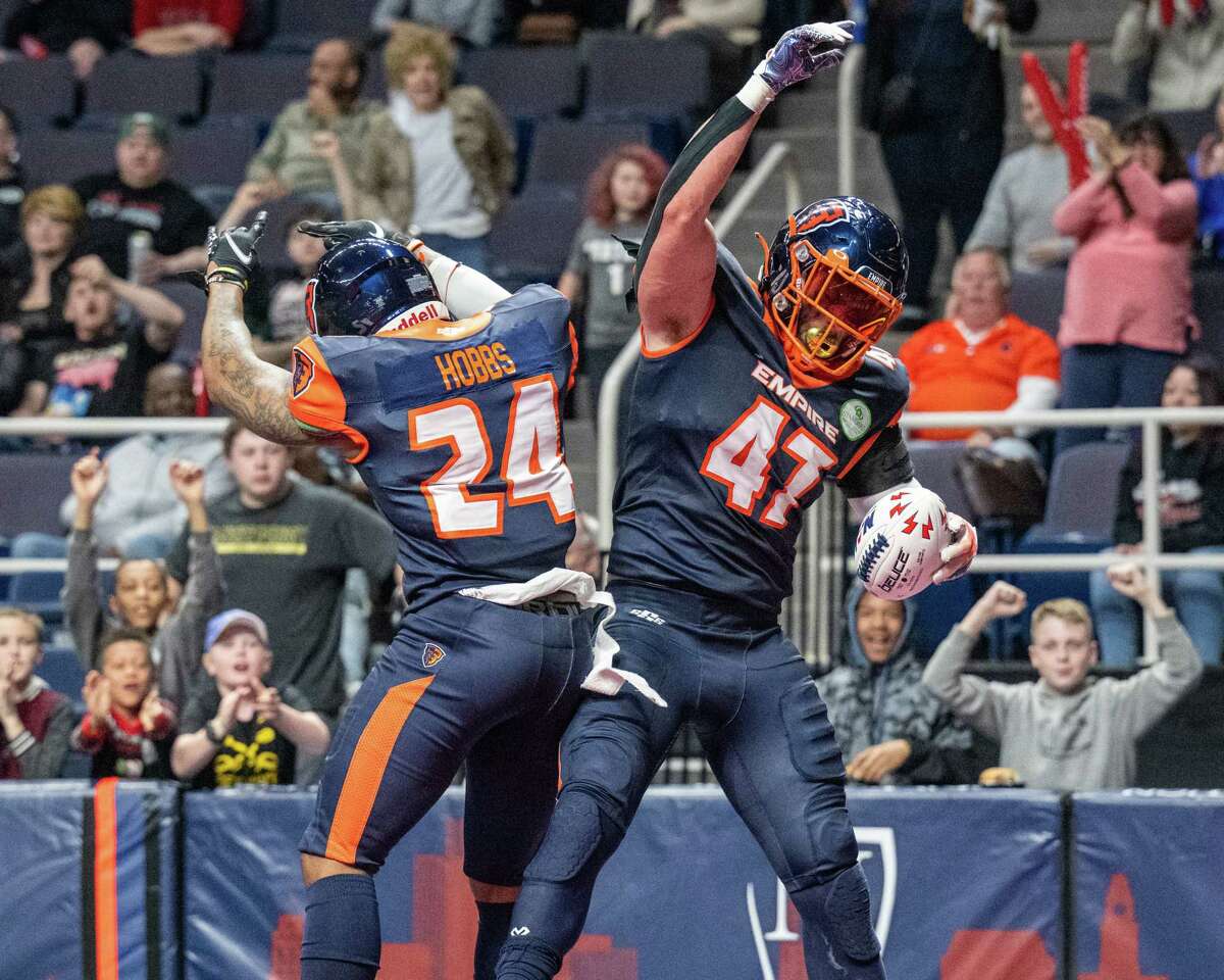 Albany Empire receiver/defensive back Arthur Dobbs (No. 24) and lineman Nick Haag celebrate a touchdown against the Carolina Cobras during a Week 1 loss. The Empire host the Cobras on Saturday in a rematch.