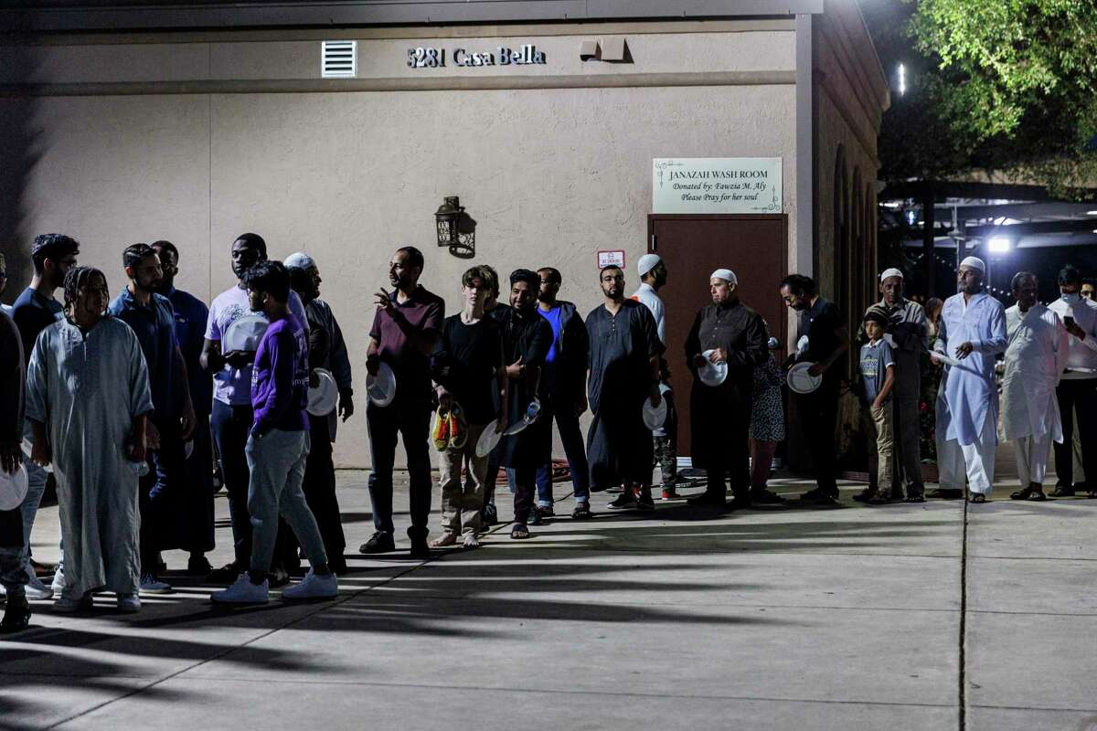 Men line up for an iftar meal Thursday during a Ramadan service at the Muslim Children Education and Civic Center and Almadinah Masjid in San Antonio.