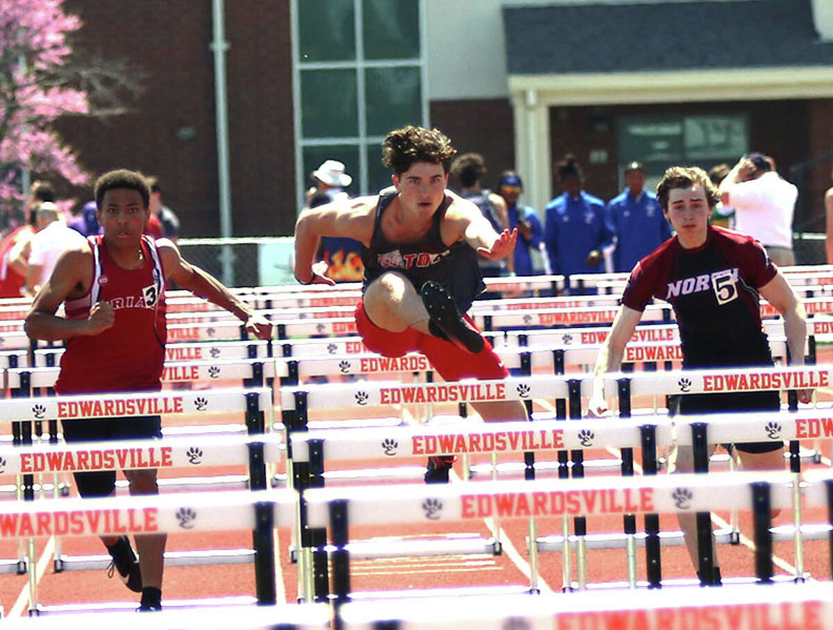 Alton's Simon McClaine (middle) leads Triad's Louis Yohannes (left) and Plainfield North's Evan Gavras in their heat of the 110-meter high hurdles on Saturday in the Winston Brown Invitational at the Winston Brown Track and Field Complex in Edwardsville.