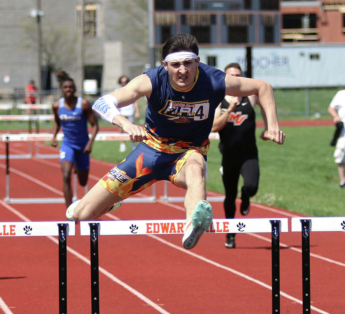 Benny Diaz clears a hurdle late in his victory in the 300-meter hurdles on Saturday at the Winston Brown Invite in Edwardsville,