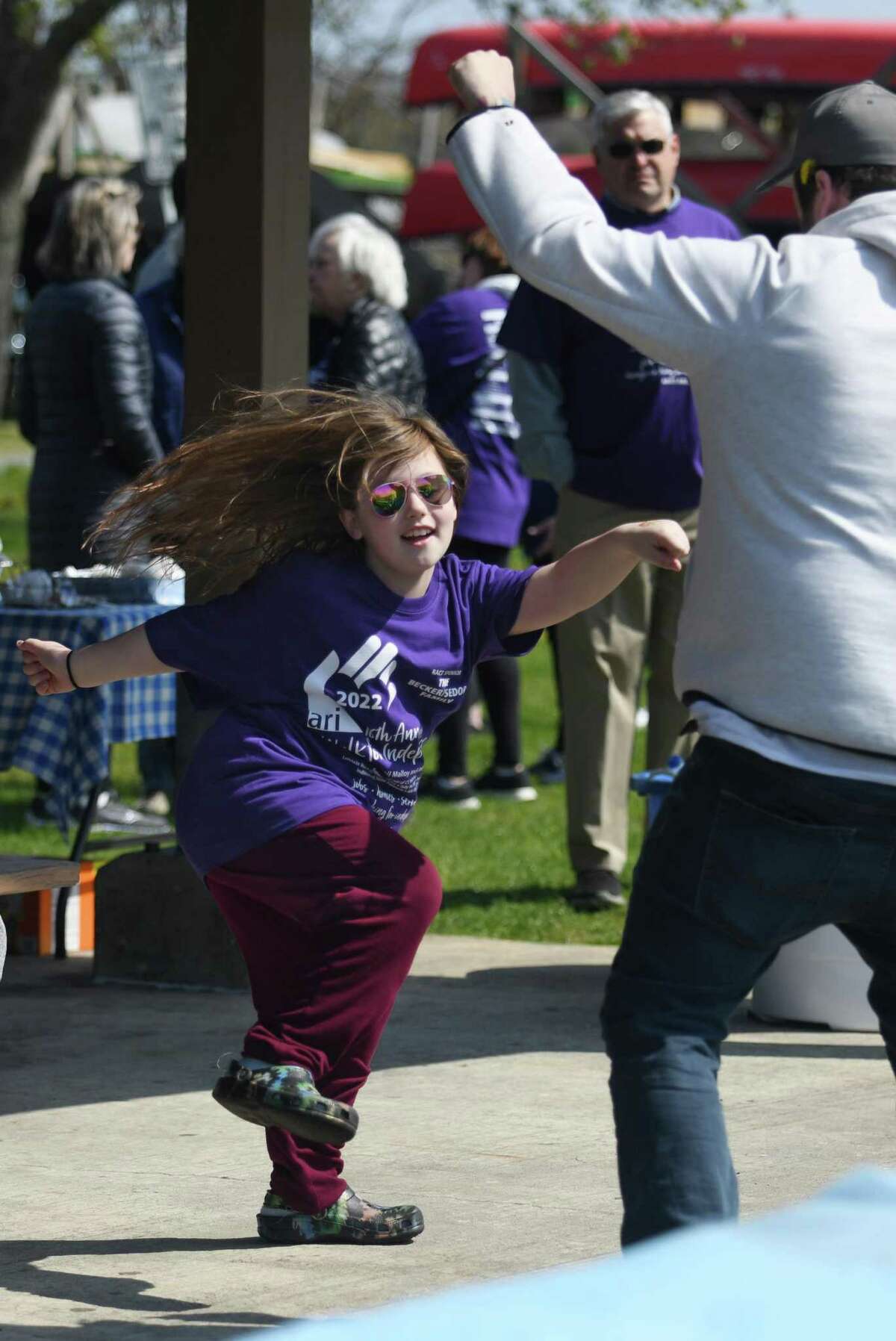 Willa Wellington, 8, of Fairfield, dances at the 16th annual ARI Walk for Independence at Cove Island Park in Stamford, Conn. Sunday, April 24, 2022. Hundreds of folks attended the walk, which serves as a fundraiser to benefit those with disabilities through employment services, housing, recreation, and clinical care. Dance With El the Ha Ha Gang clowns from Stamford Hospital were on hand to entertain before the walk.