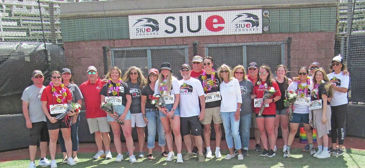 Members of the SIUE softball class of 2020 and their families gather for a photo after a Senior Day celebration between games of Saturday’s doubleheader against the University of Tennessee-Martin at Cougar Softball Field. The 2020 season was cut short by the COVID-19 pandemic and Senior Day was canceled as well.