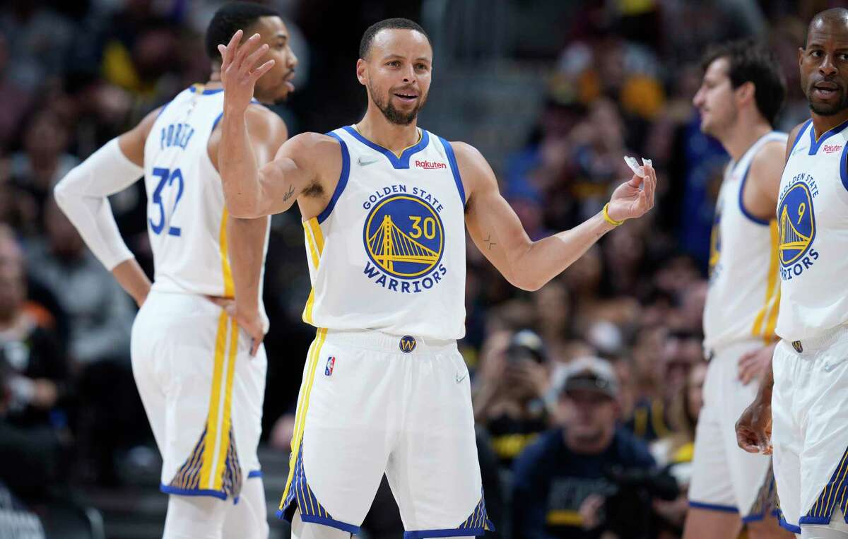 Golden State Warriors guard Stephen Curry (30) argues after he was called for a foul in the first half of Game 4 of an NBA basketball first-round Western Conference playoff series against the Denver Nuggets, Sunday, April 24, 2022, in Denver. (AP Photo/David Zalubowski)