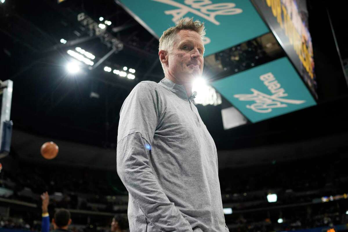 Warriors head coach Steve Kerr heads to the bench in the first half of Game 4 of an NBA basketball first-round Western Conference playoff series against the Denver Nuggets, Sunday, April 24, 2022, in Denver. (AP Photo/David Zalubowski)