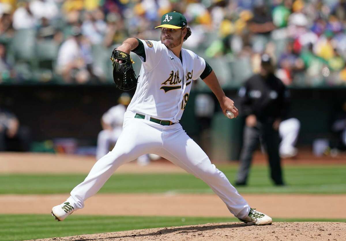 Oakland Athletics' Cole Irvin pitches against the Texas Rangers during the fourth inning of a baseball game in Oakland, Calif., Sunday, April 24, 2022. (AP Photo/Jeff Chiu)