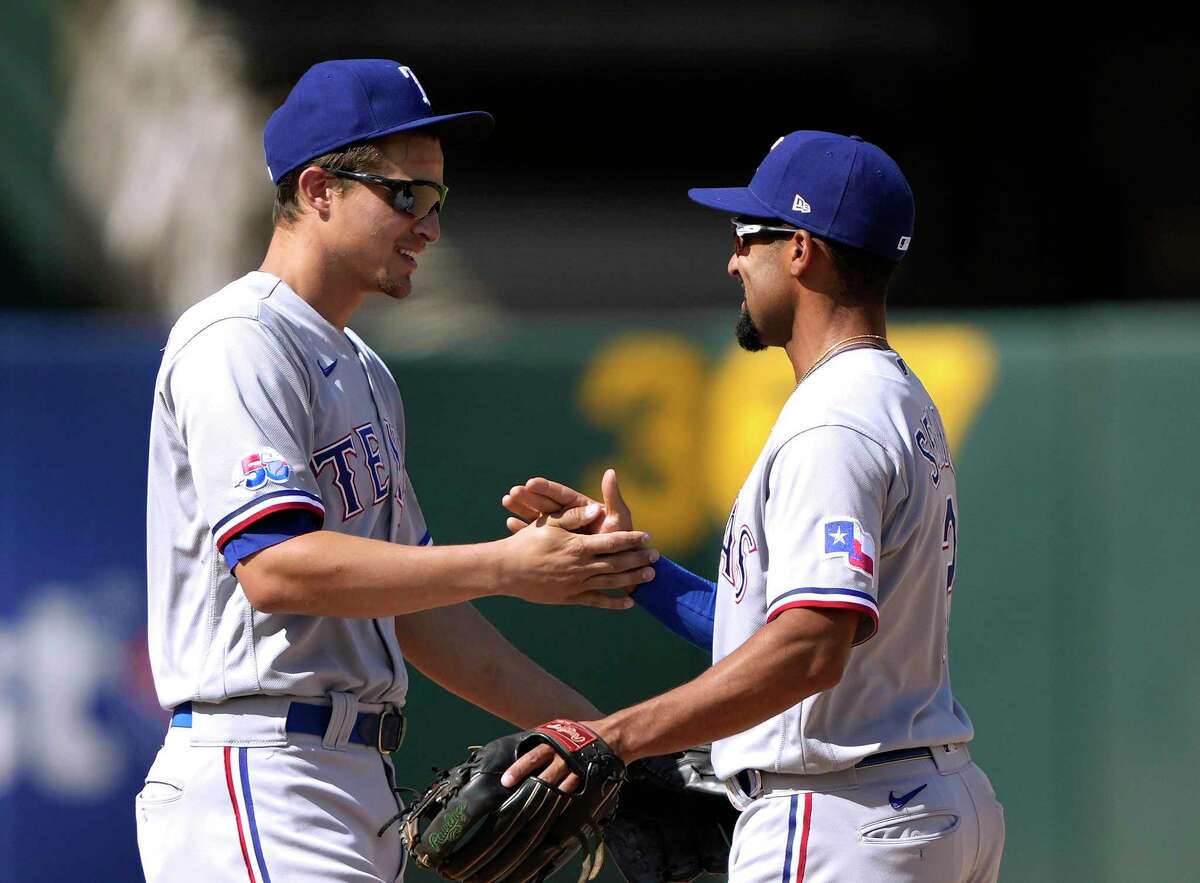 Although they celebrated a 2-0 victory at Oakland on Saturday, Rangers shortstop Corey Seager, left, and second baseman Marcus Semien have yet to get on track at the plate, hitting .241 and .183, respectively, so far.