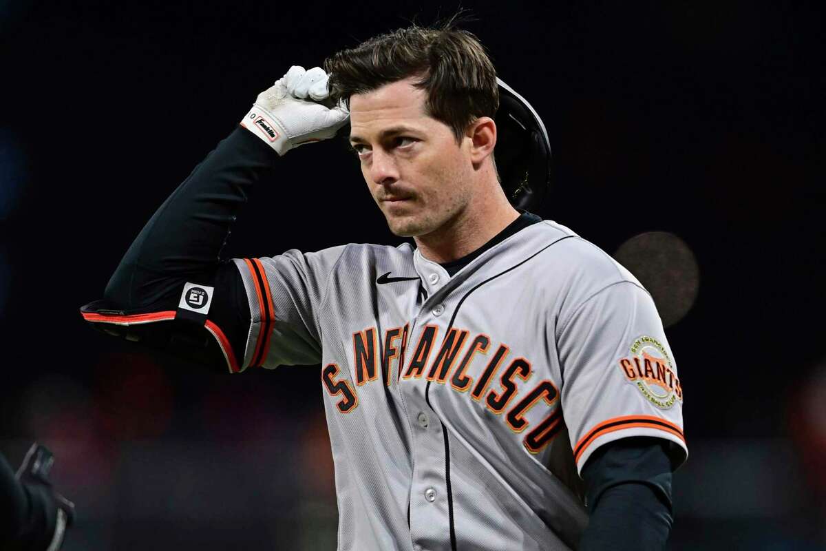San Francisco Giants' Mike Yastrzemski reacts after grounding out in the seventh inning of a baseball game against the Cleveland Guardians, Saturday, April 16, 2022, in Cleveland. (AP Photo/David Dermer)