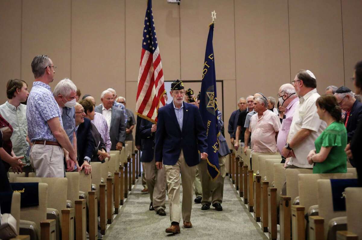 David Lavine, the commander of the Jewish War Veterans Post 574 Houston-Levy, leads members of the post as the carry the colors during a Yom HaShoah ceremony for Holocaust Remembrance Day on Sunday, April 24, 2022, at Congregation Beth Israel in Houston.