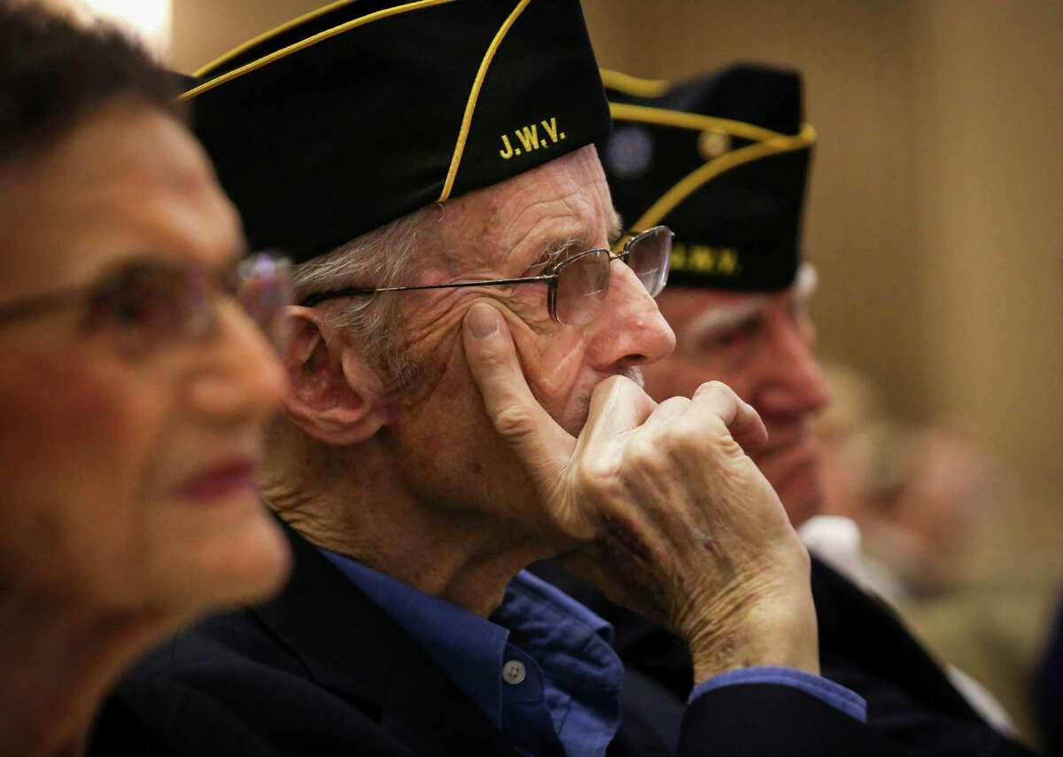 Frank Shaw, a member of the Jewish War Veterans Post 574 Houston-Levy, listens during a Yom HaShoah ceremony for Holocaust Remembrance Day on Sunday, April 24, 2022, at Congregation Beth Israel in Houston.