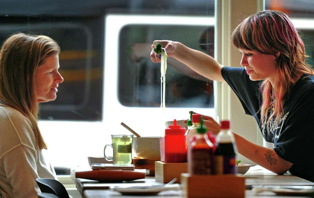 Tina Mangold and her daughter Sofia, eat lunch at Pho Fans, a new Vietnamese restaurant in Darien on April 19.