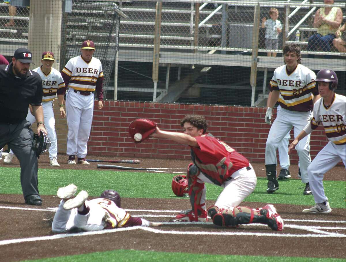 Deer Park's Wyatt Woodall slides across home plate with the dramatic winning run Saturday afternoon, enabling the team to come all the way back from a 7-2 deficit against Langham Creek.