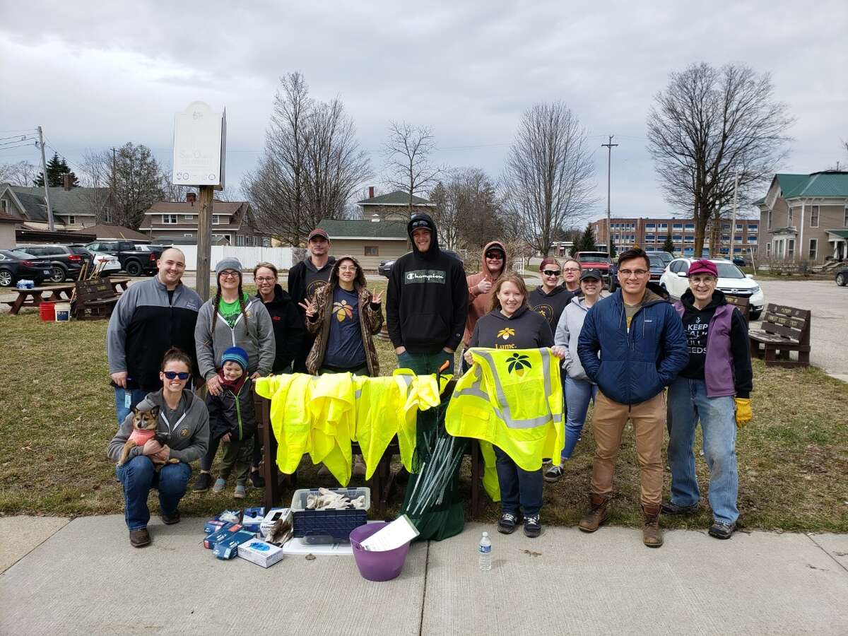 Evart Garden Club, along with over 70 volunteers from Lume Cannabis Company in Evart spent Earth Day cleaning up flowerbeds around the city, picking up trash in city parks and preparing a large stump for removal at Guyton Park.