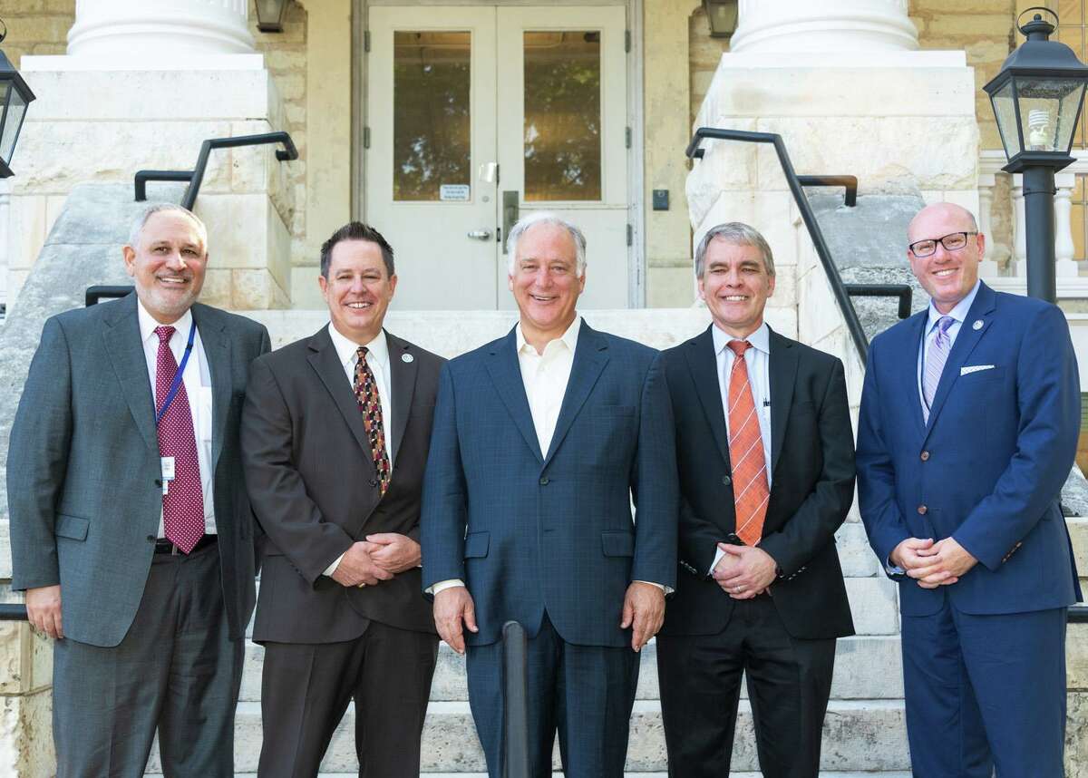 Tim Bray (far right) with a group of Texas Health and Human Services Commission leadership at the rededication of Austin State Hospital's "Old Main" building.