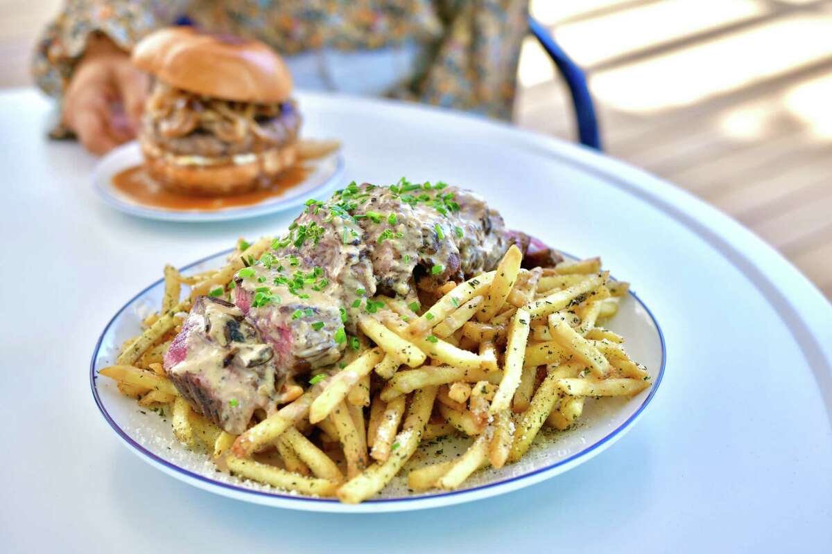 The owner of Savoir restaurant in the Heights will open Heights & Co., a casual restaurant and patio bar at 1343 Yale, across from Savoir. Opening May 5. Shown: Steak frites with au poivre sauce.