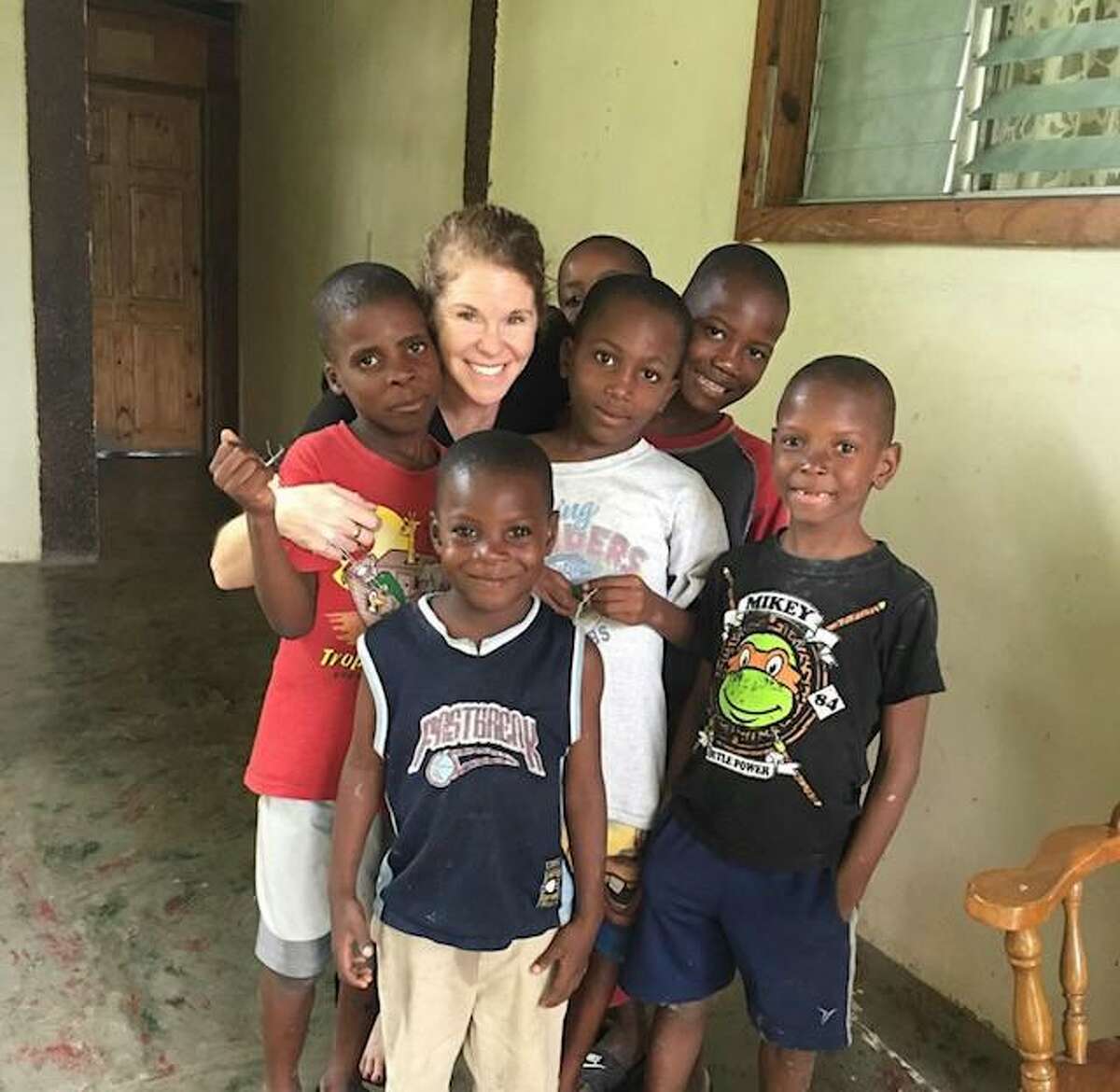 Dr. Beckie D’Andrea with some of the children she has worked with in Haiti.