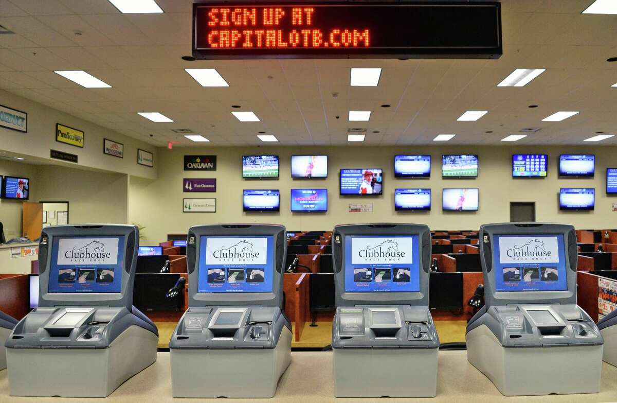 Self serve terminals inside the Albany OTB clubhouse on Central Avenue Wednesday Feb. 4, 2015, in Albany, NY.  Legislators are now considering a possible merger between the Capital District Regional Off-Track Betting Corporation and the Catskill Regional Off-Track Betting Corporation. (John Carl D'Annibale / Times Union)