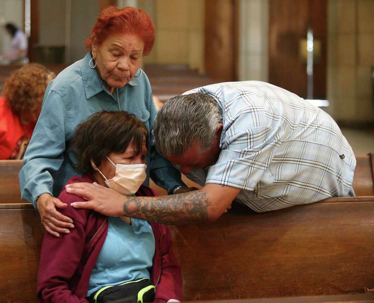 Juanita Hernandez, sister of Esperanza, and her son Juan hug Esperanza "Hope" Trevino, of Harlingen, the mother of Melissa Lucio, during a vigil at the Basilica Of Our Lady of San Juan del Valle National Shrine, Friday, April 22, 2022, in San Juan, Texas. Melissa Lucio is the first woman of Hispanic descent in Texas to be sentenced to death. She was convicted of capital murder after the death of her 2-year-old daughter, Mariah. (Delcia Lopez/The Monitor via AP)