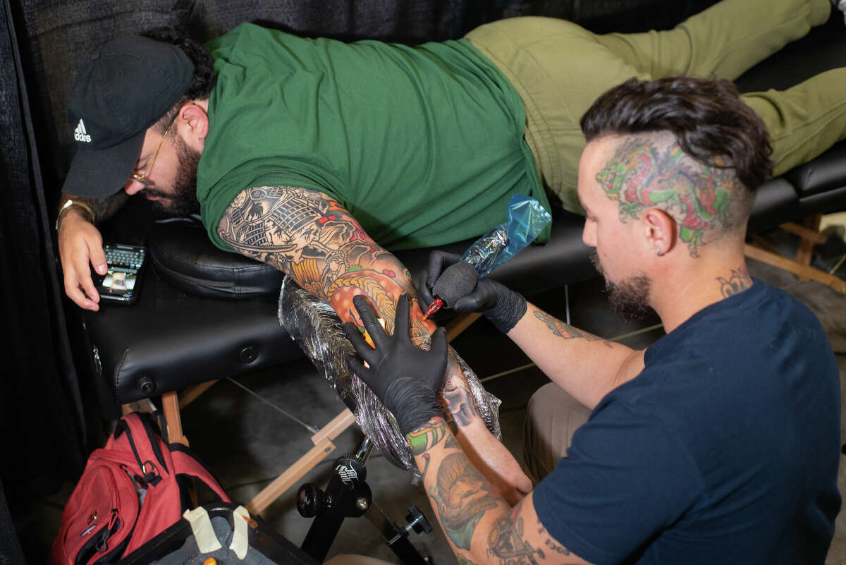 Isamel Caso being tattooed by tattoo artist Manny Abete on Saturday, Apr. 23, 2021, at the fifth annual Por Vida International Tattoo Festival at the Webb County Pavilion.