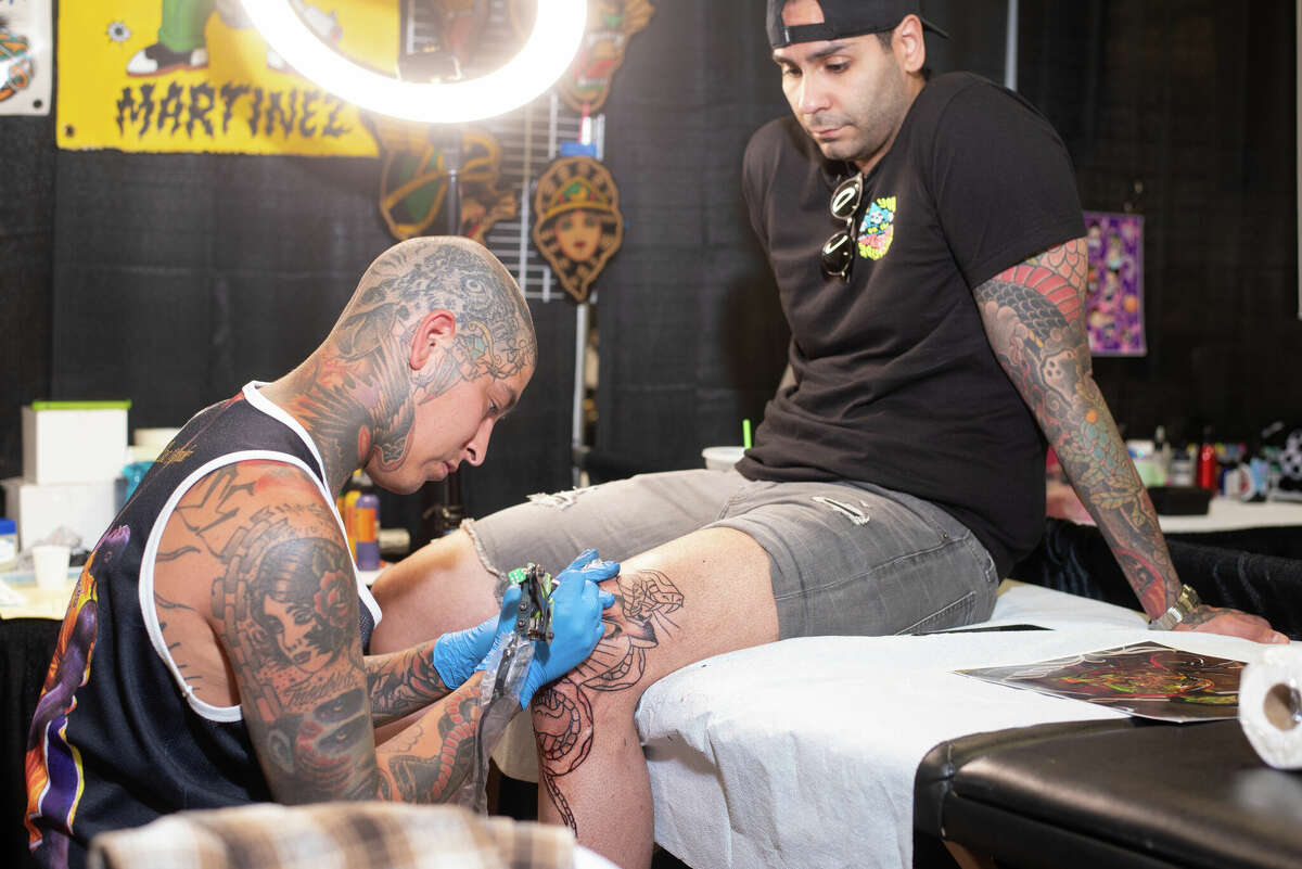 Victor Barroso being tattooed by tattoo artist Harley Martinez on Saturday, Apr. 23, 2021, at the fifth annual Por Vida International Tattoo Festival at the Webb County Pavilion.